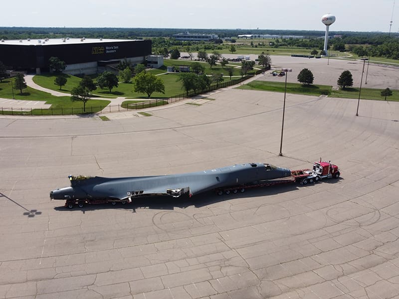 A B-1B 86-0101 is pulled by a truck.