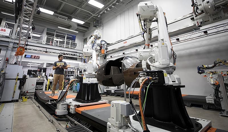 A Wichita State University student operates machinery at Advanced Robotics Manufacturing Institute.