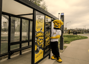 Picture of Wu Wu waiting at a shuttle stop.
