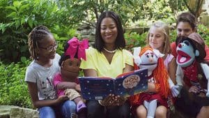 Prisca Barnes, founder and CEO of Storytime Village, reads to children.