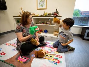 Dr. Jody Fiorini, chair of Intervention Services and Leadership in Education for Wichita State’s College of Applied Studies, works with a client at the WSU Integrated Support and Empowerment (WISE) Clinic.
