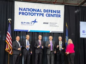 State leaders pose for photo at a grand opening event and ribbon cutting ceremony Oct. 15 for its National Defense Prototype Center (NDPC).