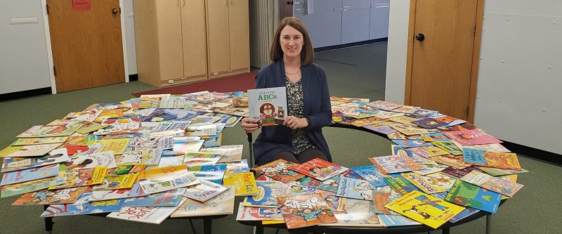 Picture of Melissa Vagts with donated books.