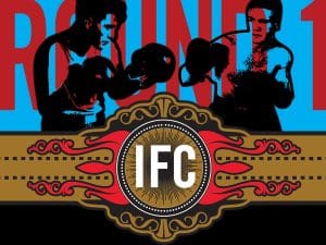 Bold graphic of two boxers with the words "Round 1" behind them in red letters. In front of the boxers there is a champions belt that says "IFC" inside.