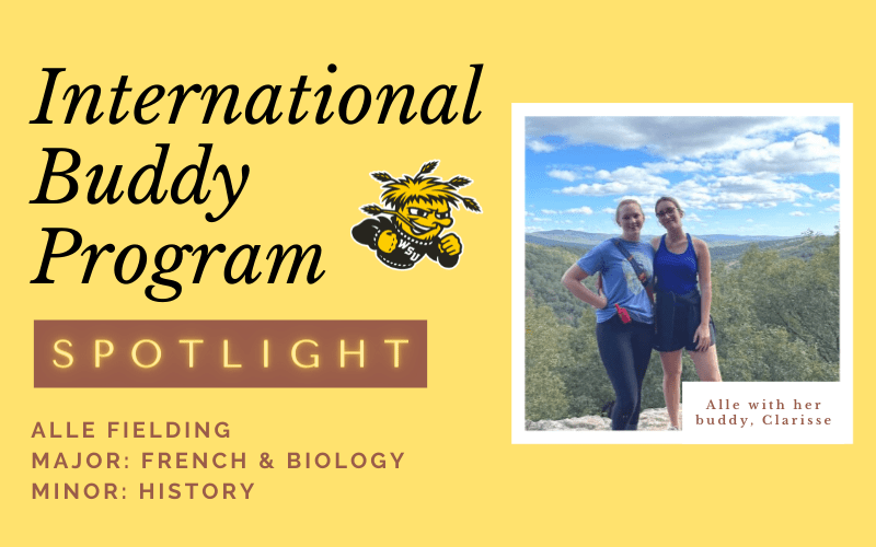 Text stating "international buddy program" box below that stating spotlight. text below that stating Alle Fielding, major French and Biology minor history. WU shock logo to the right. to the right of that is a picture of Alle and her buddy on a rock with trees in the background with the caption Alle with her buddy Clarisse