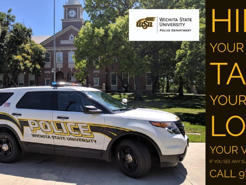 WSUPD vehicle parked in front of Morrison Hall with words ‘Hide your items, Take your keys, Lock your vehicle if you see any suspicious activity call 978-3450’ on a side bar.
