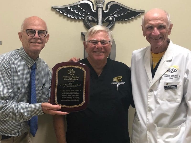 Dr. Elledge, Dr. Evans and Dr. May pose with the 2022 Sandra Mitchell Memorial Award for Community Service.