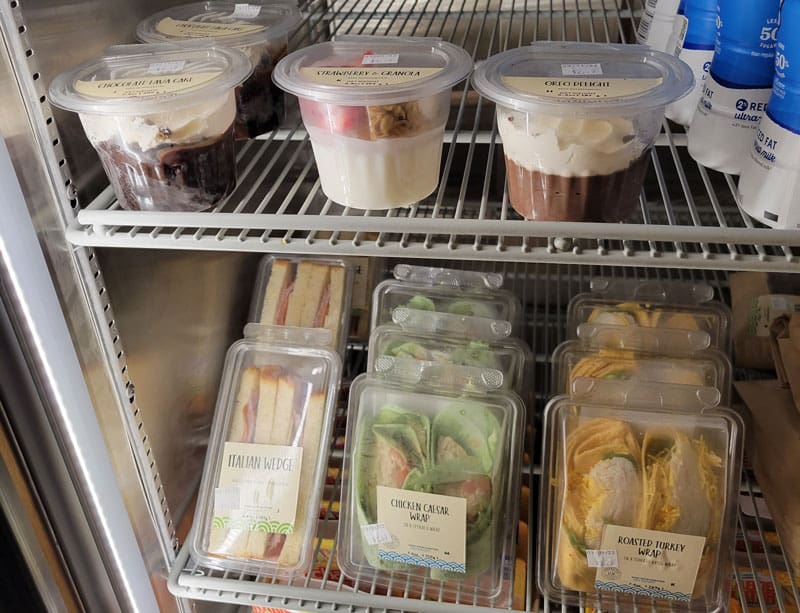 Image of new food items in cold case at the Shocker Store.