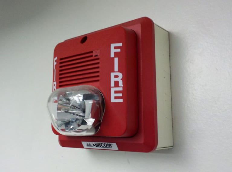Image of fire alarm on wall.