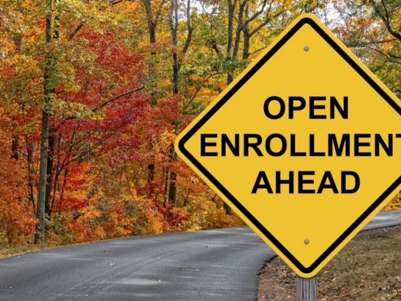 Image of road sign on country road reading Open Enrollment ahead.