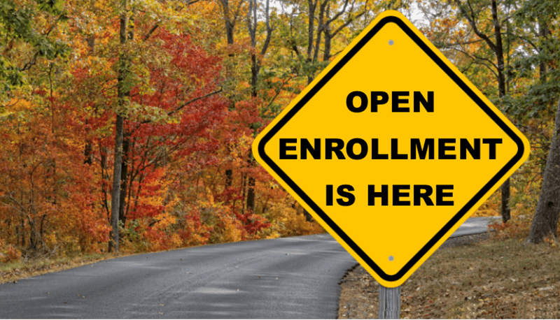 Image of road sign with text Open Enrollment is here.
