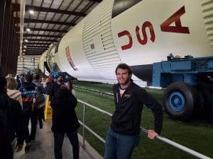 Image of Alexander Sterzing standing in front of rocket.