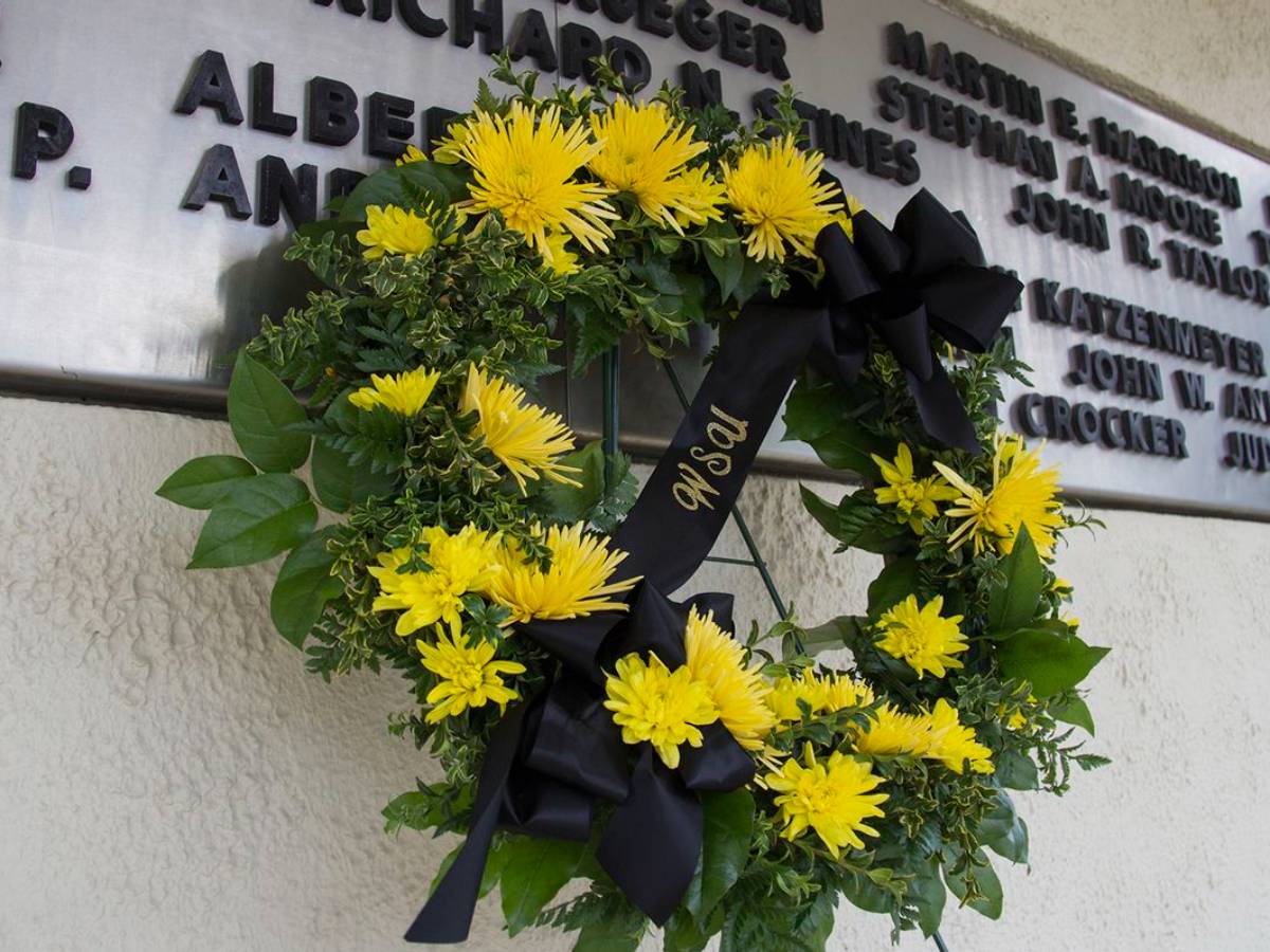 Image of A wreath placed at the Memorial '70 monument on the Wichita State campus, which honors the 31 lives lost on Oct. 2, 1970 in a plane crash.