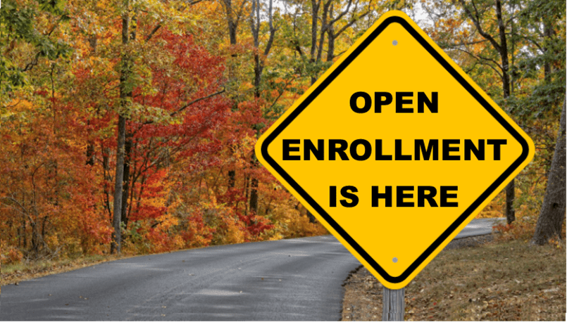 Image of road sign with text Open Enrollment is here.