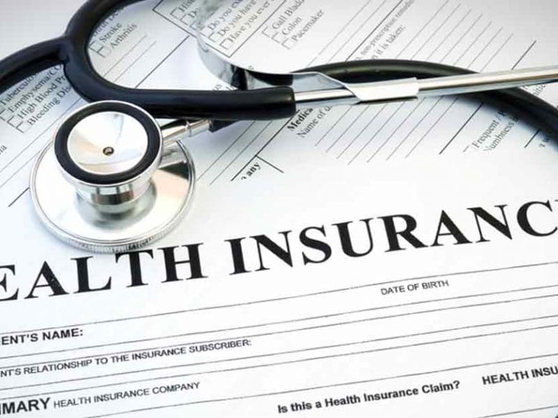 Health Insurance paper with stethoscope