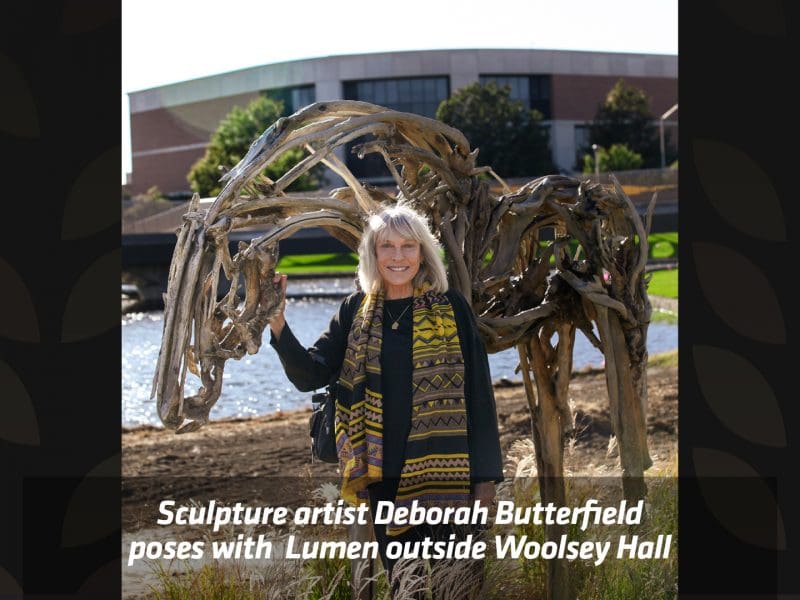 Sculpture artist Deborah Butterfield poses with Lumen outside Woolsey Hall