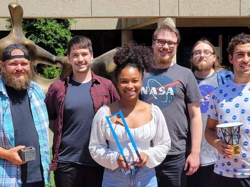 Wichita State students and staff working on the grant project, “Cube-sat Space Flight Test of a Neutrino Detector,” include (from left) Jarred Novak, Trent English, Ayshea Banes, Jonathan Folkerts, Brian Doty and Octavio Pacheco. Novak, English and Folkerts traveled to Paris this fall to present their work on the project.