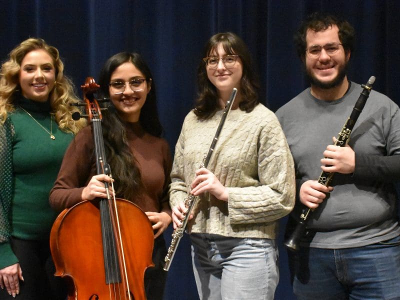 Photo of the six student soloists: Nicholas Welicky, horn; Ashley Ruckman, soprano; Mengielly Diaz Cortes, cello; Sarah Rodriguez, flute; Brandon Rodriguez, clarinet; and Elyssa Astegiano, clarinet.