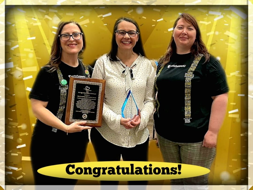 Photo of Dr. Jessica Provines, Sonja Armbruster and Dr. Marci Young holding the awards they received with the text, "Congratulations!"