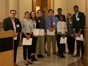 Group picture of WSU students and deans that participated at the Capitol Graduate Research Summit in Topeka, Kansas.