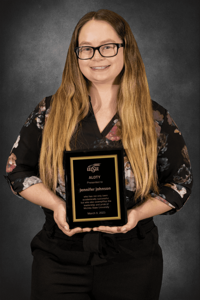 Photo of Jennifer Johnson, who was the 2023 Adult Learning of the Year winner, holding her award plaque.