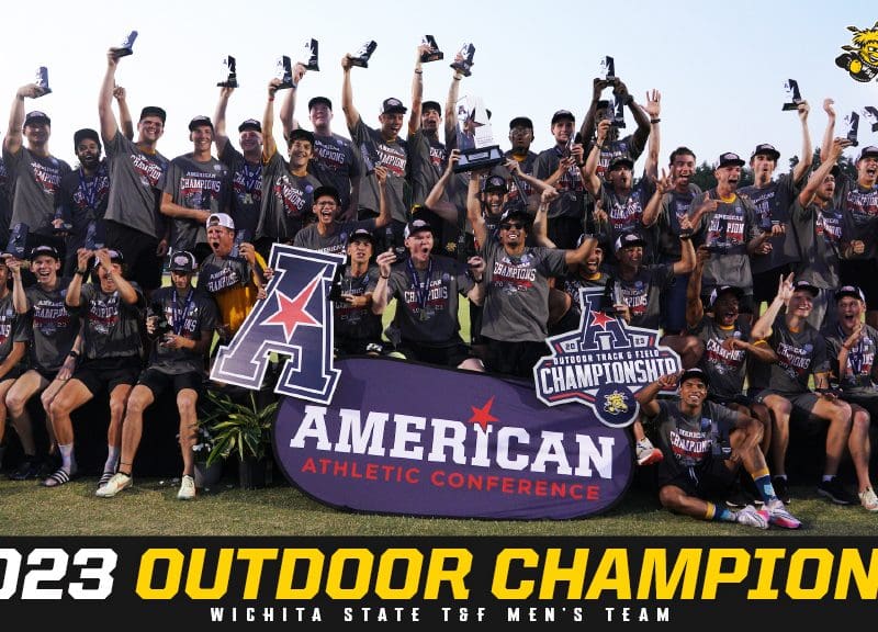 Photo of the Shockers men's track & field team, holding an "American Athletic Conference" sign, celebrating its 2023 AAC outdoor title.