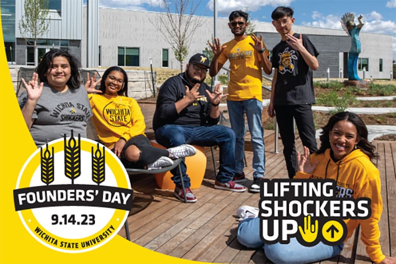 Students on campus giving the WSU Shocker hand sign. Founders' Day of Giving 2023 - Lifting Shockers Up