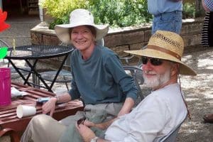 Drs. David and Deborah Soles, seated outdoors at a cafe table in Taos, New Mexico.