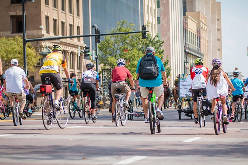 A group of bicyclers ride down Douglas Avenue.