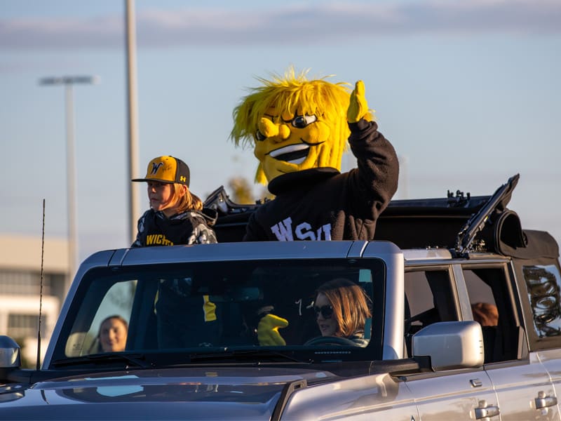 Wu waves to the crowd during the Shocktoberfest Parade