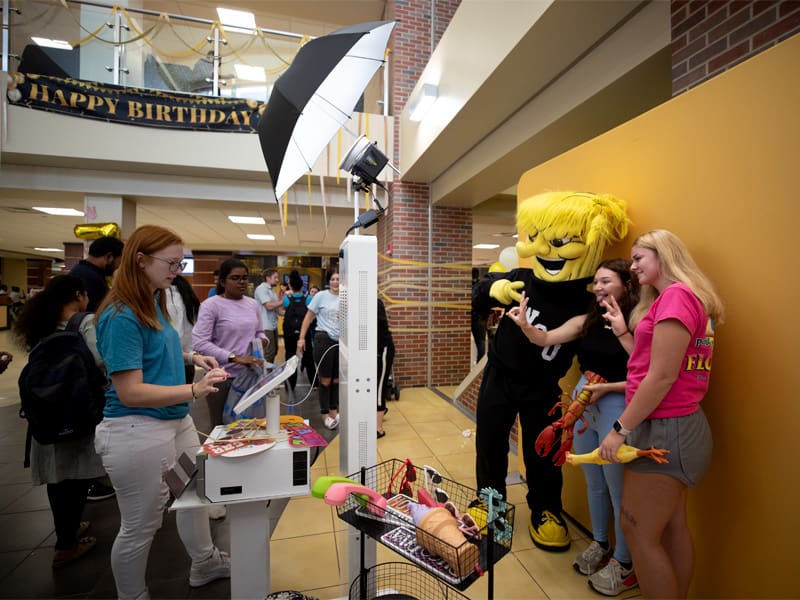 Shockers pose with Wu during Wu's Birthday Bash Oct. 2