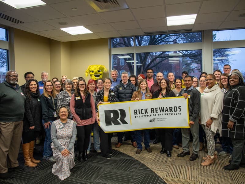 Faculty and staff who have achieved the WSU Internal Control All-Star recognition pose with President Rick Muma and Wu for Rick Rewards