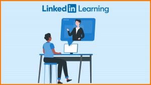 Person sitting at a computer watching a LinkedIn Learning video course.