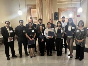 WSU students and faculty standing with awards at 2024 CGRS award ceremony