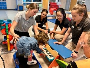 Physical Therapy students work with pediatric patient at Heartspring