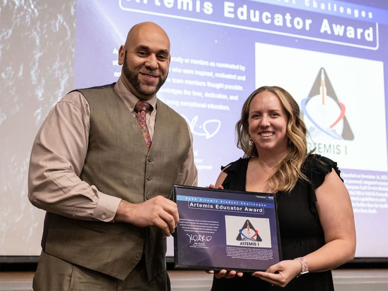 Kristyn Waits receives the Artemis Educator Award at NASA SUITS in Houston.