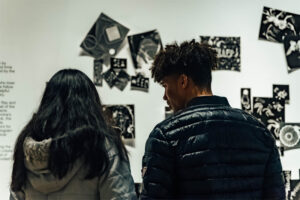 Two art lovers enjoy work at the Ulrich