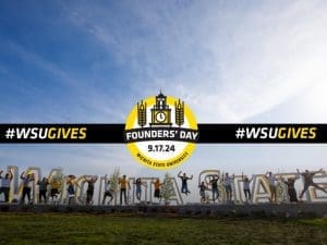 The Founders' Day of Giving logo is superimposed on an image of students jumping in the air in front of the Wichita State sign.