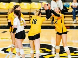 Shockers celebrate during a volleyball game