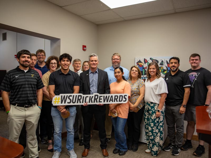 President Rick Muma poses with members of the Office for the Vice President of Administration and Finance for Rick Rewards