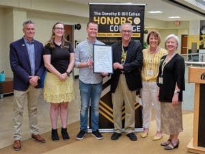 President Rick Muma; Honors alumni Rachel Tuck and Andrew Longhofer; Clark Shultz, mayor of Lindsborg, Kansas; Shirley Lefever, executive vice president and provost; Kimberly Engber, dean of the Cohen Honors College at the 10-year proclamation