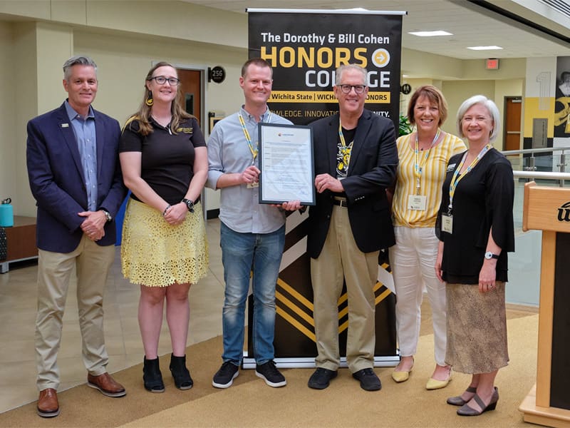 President Rick Muma; Honors alumni Rachel Tuck and Andrew Longhofer; Clark Shultz, mayor of Lindsborg, Kansas; Shirley Lefever, executive vice president and provost; Kimberly Engber, dean of the Cohen Honors College at the 10-year proclamation