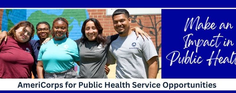 Group of AmeriCorps members standing in front of a mural