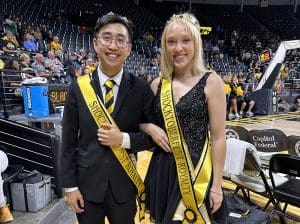 Matthew Phan (left) and Riley McMillan pose for a photo after being named Shocker royalty.