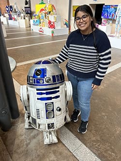 Nataleigh Holguin with R2D2 from Star Wars.