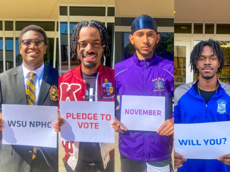 Four members of the Divine 9 - the designation given to the nine NPHC fraternities and sororities - got together recently to deliver that message and demonstrate Greek unity. The four, representing the Delta Mu Chapter of Alpha Phi Alpha Fraternity, Inc., Delta Upsilon Chapter of Kappa Alpha Psi Fraternity, Inc.,  the Epsilon Psi Chapter of Omega Psi Phi Fraternity, Inc., and the Gamma Nu Chapter of Phi Beta Sigma Fraternity, Inc., put their message in writing. A member representing each organization held up a sign declaring their intention to go to the polls.  The Alpha Phi Alpha representative held up a sign that read: "WSU Greeks."  The Kappa Alpha Psi representative's sign read: "Pledge to Vote."  The Omega Psi Phi  representative's sign read: "November."  The Phi Beta Sigma representative's sign read: "Will you?"