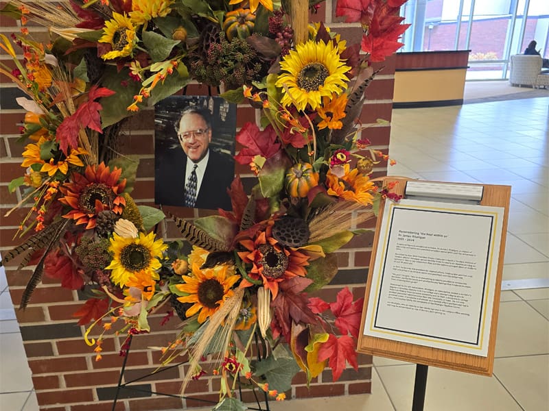 A photo of the wreath that is in the Rhatigan Student Center in remembrance of Dr. James Rhatigan