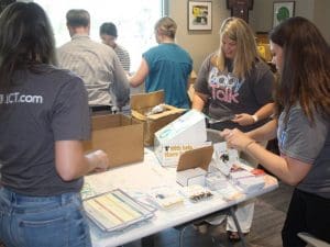 Students, faculty and staff assemble the HOPE kits in the Student Wellness Center