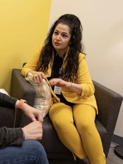 Mahsa Maghsoudi works with a patient