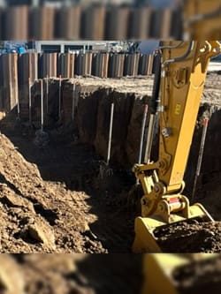 Close-up view of the digging on the piles on-site